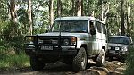 01-Gaby waits in the Troopy while Ryan checks a mud hole